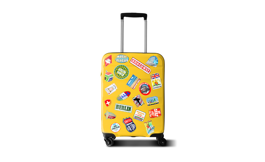 An image of yellow luggage with stickers