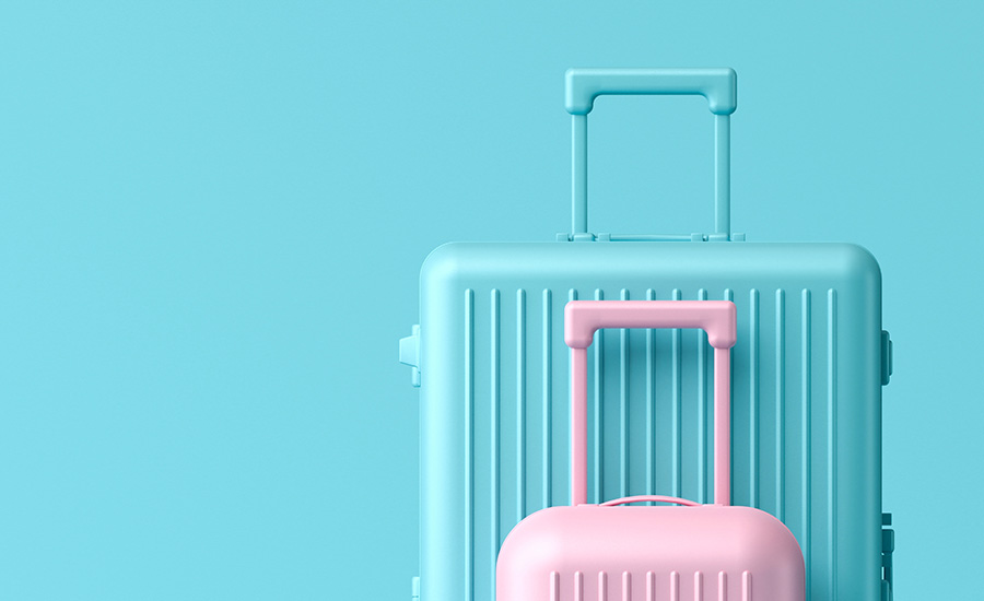 An image of a blue and pink suitcase